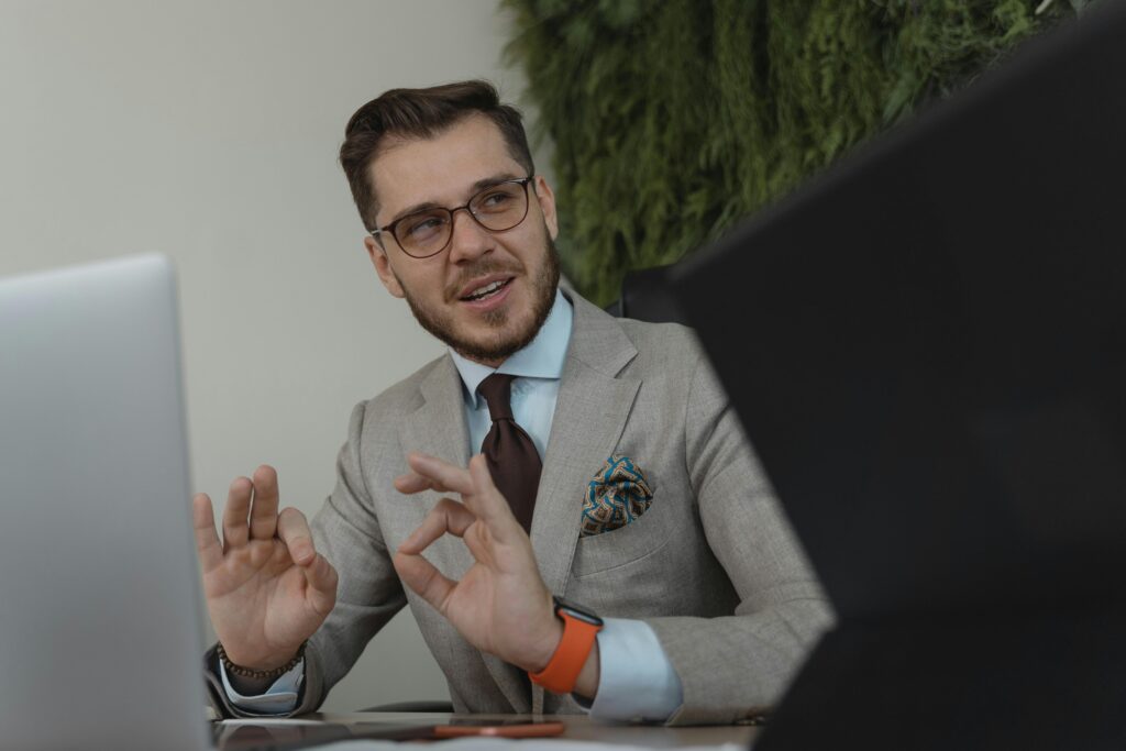 Professional businessman engaging in a discussion at his workplace, conveying confidence and leadership.
